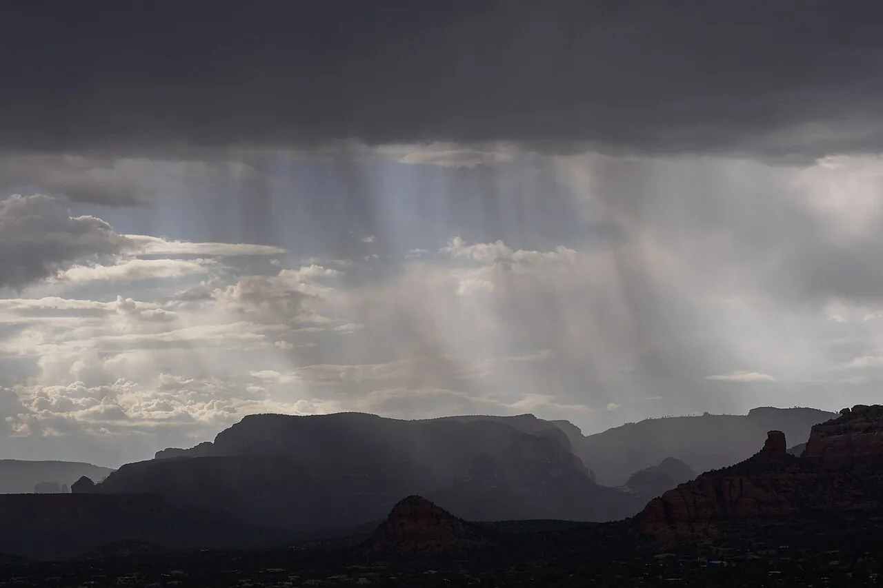 Storm clouds gathering over Sedona's red rock formations