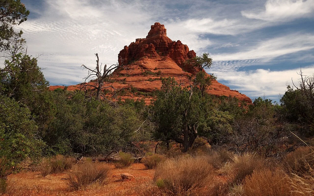 The packed red-dirt Bell Rock Pathway winding through high desert toward the formations