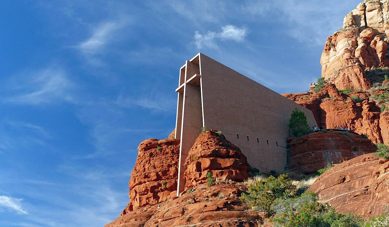 Exterior view of the Chapel of the Holy Cross set against Sedona's red rock cliffs