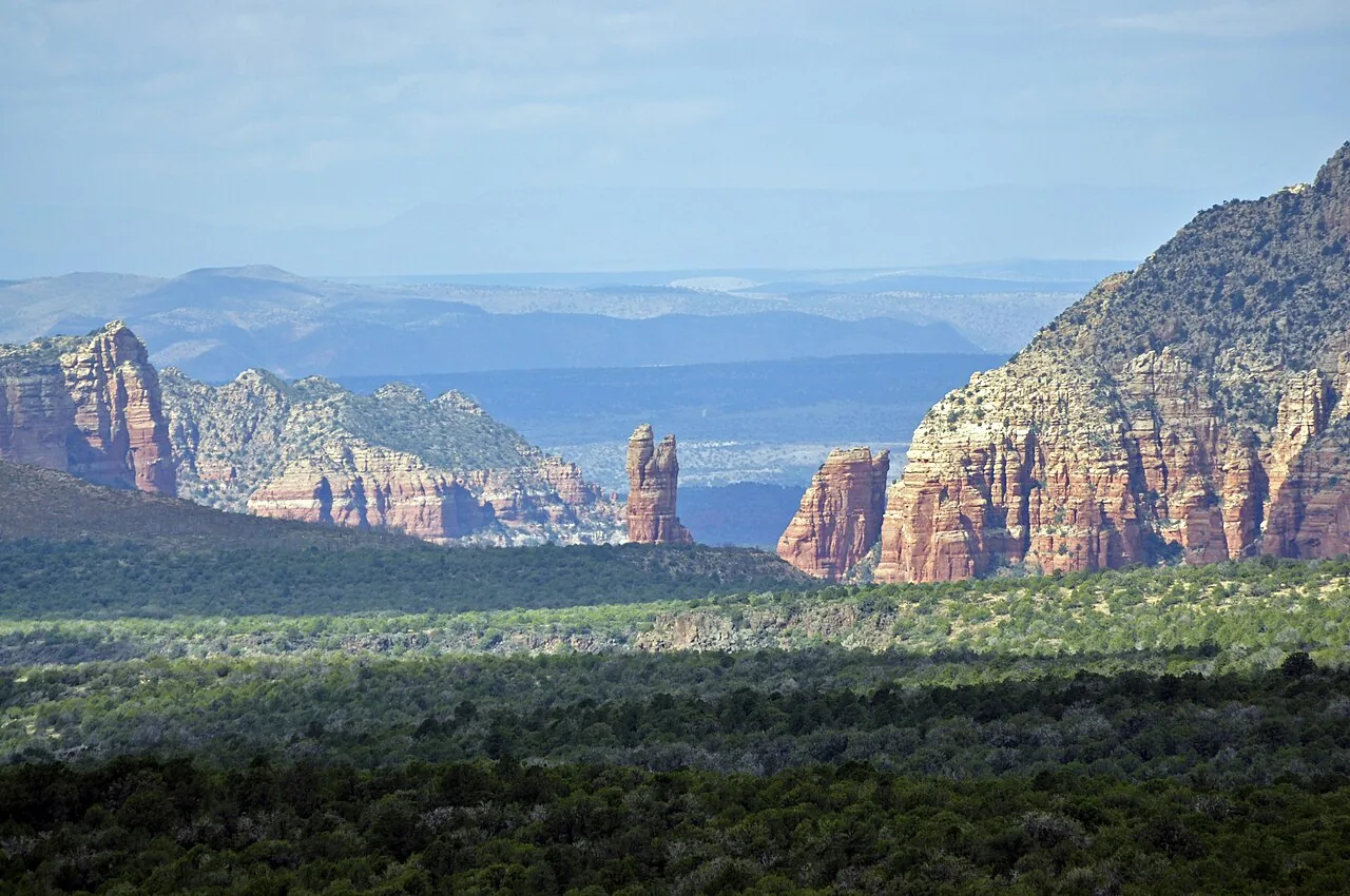 Oak Creek flowing past trees and red rock in Sedona, Arizona