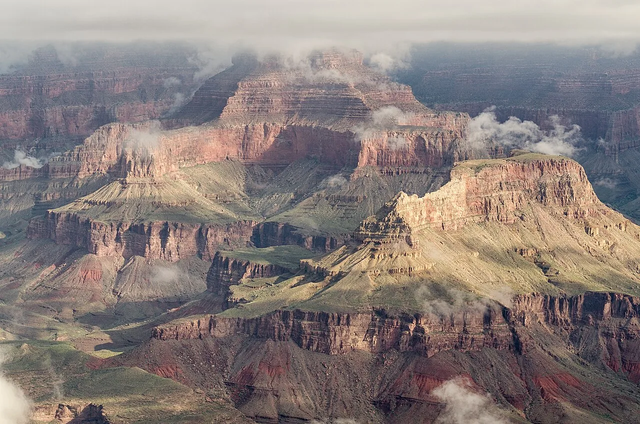 Visitors at the railed Mather Point overlook looking out over the Grand Canyon
