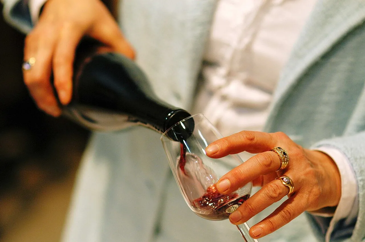 A glass of red wine, the kind poured in Old Town Cottonwood's tasting rooms