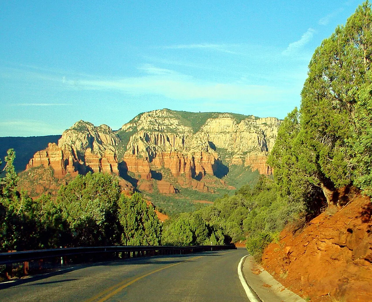 The long masonry cliff dwelling of the Honanki Heritage Site set against red rock walls near Sedona, Arizona