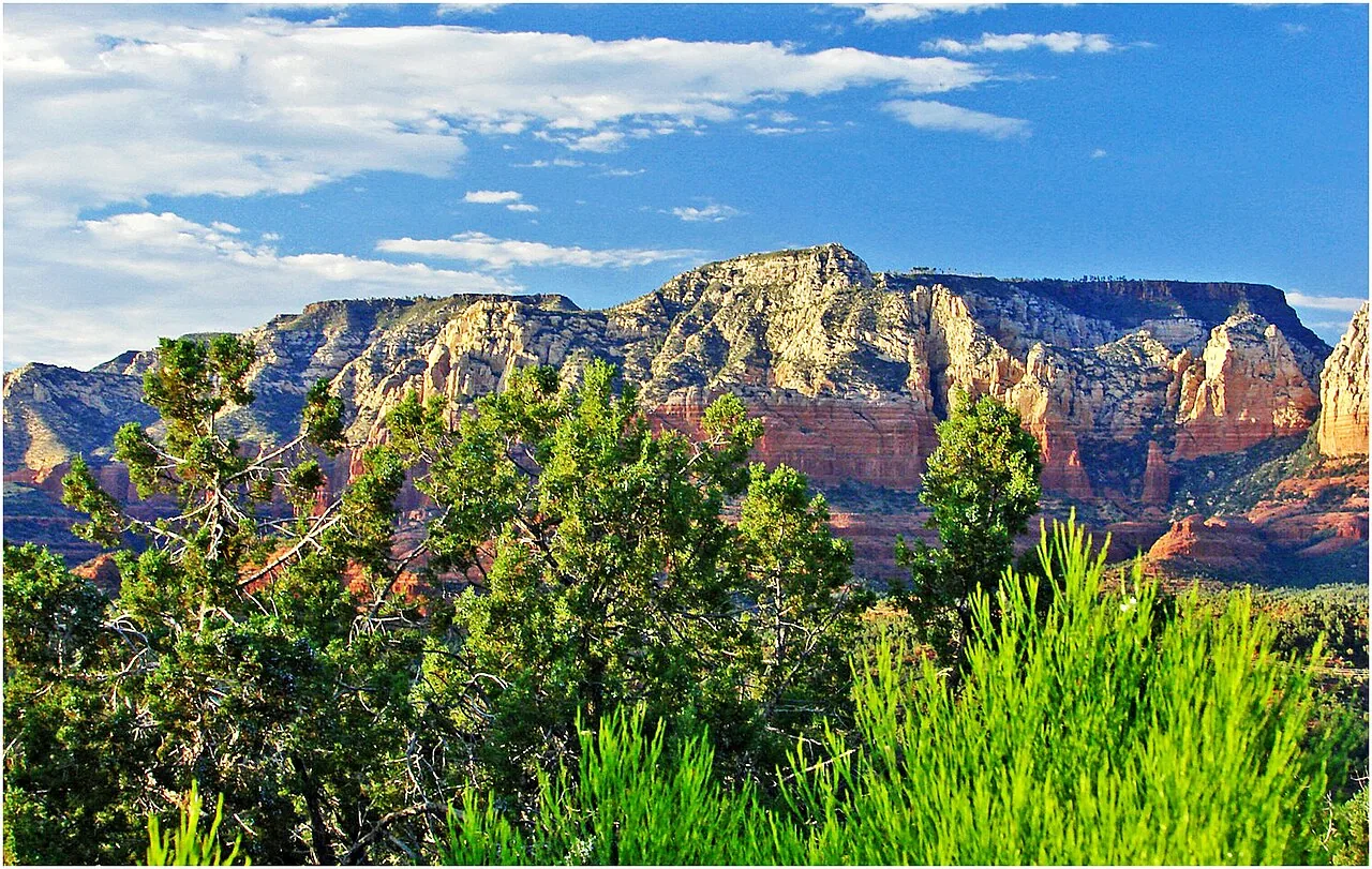Sedona's red rock formations glowing in warm low-angle light near sunset