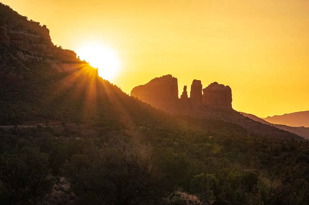 The Amitabha Stupa surrounded by red rock and trees at the Peace Park in West Sedona