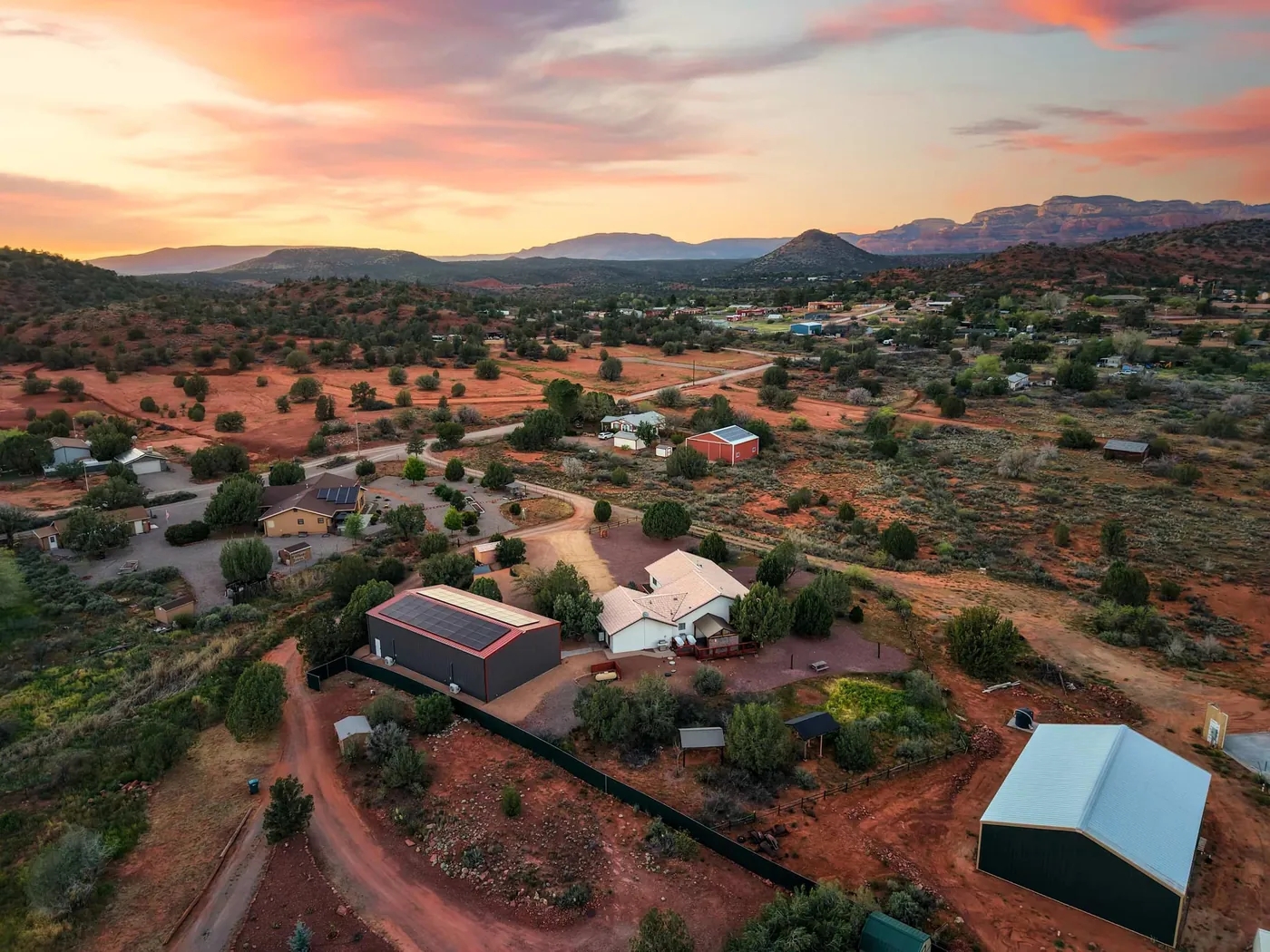 Aerial view of the home in West Sedona with distant red-rock cliffs