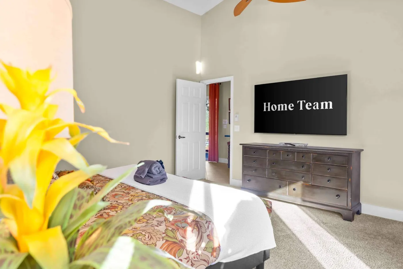 Bedroom with a wall-mounted TV