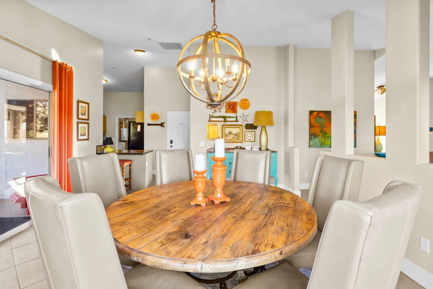 Dining area beneath a statement light fixture
